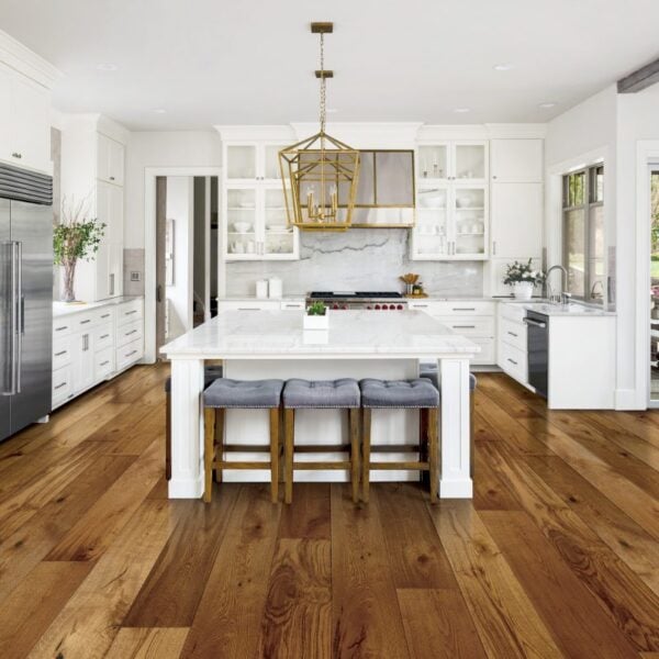 Modern kitchen with natural hardwood flooring.